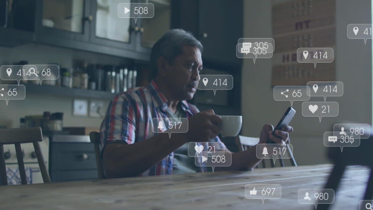 Animation of media icons over biracial man using smartphone