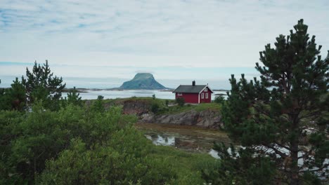 red cottage on lovund island village in sleneset, nordland norway