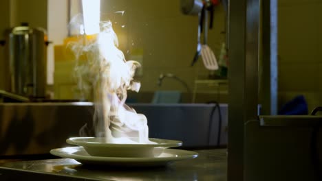 hot steamy soup served on plate 4k