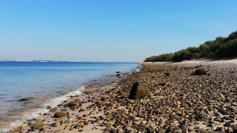 Water-hitting-the-beach-in-Troia