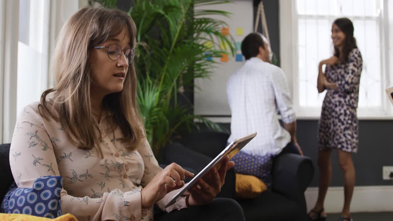 Millennial creative professionals working in a creative office
