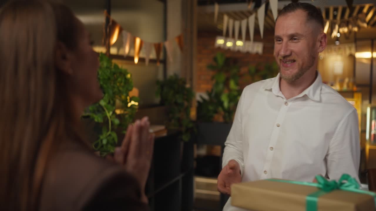 Couple Celebrating with a Gift