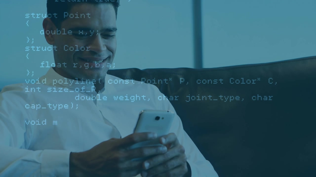 Animation of programming language over smiling businessman using phone and sitting on sofa