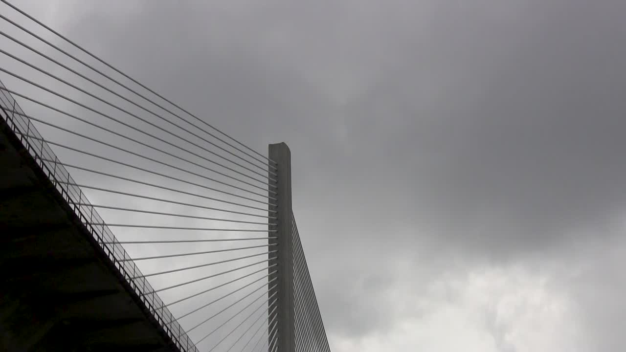 Upward view while travelling under a bridge along the Panama Canal