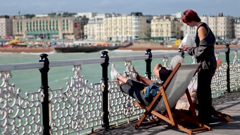 couple relaxing on pier with ocean view