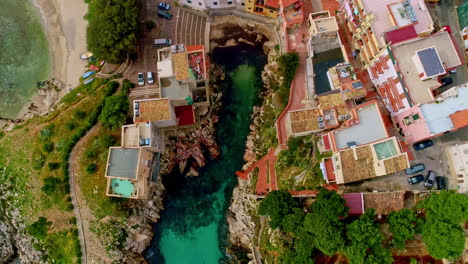 aerial drone top view of a beautiful coastal town of caletta sant'elia, santa flavia pa in italy at daytime