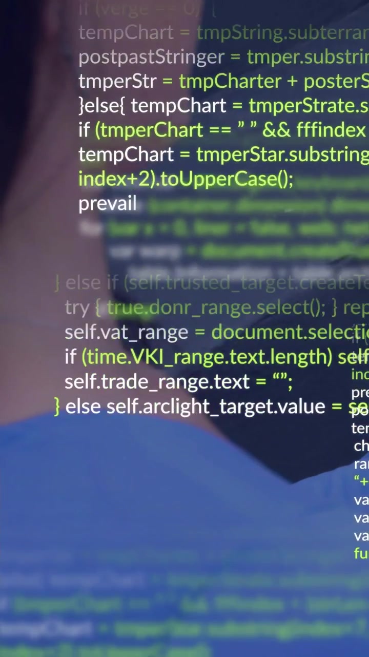 Vertical video: Developer running build and watching scrolling code overlaying screen for debugging