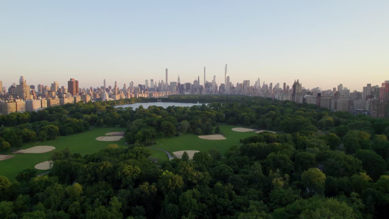 Beautiful summer evening in Central Park, drone shot with sports fields and park space, NYC