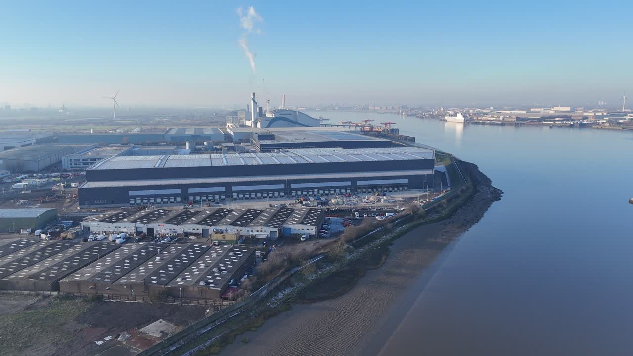 Industrial area River Thames UK smoke rising from power plant drone,aerial
