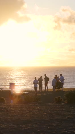 sunset beach scene with people