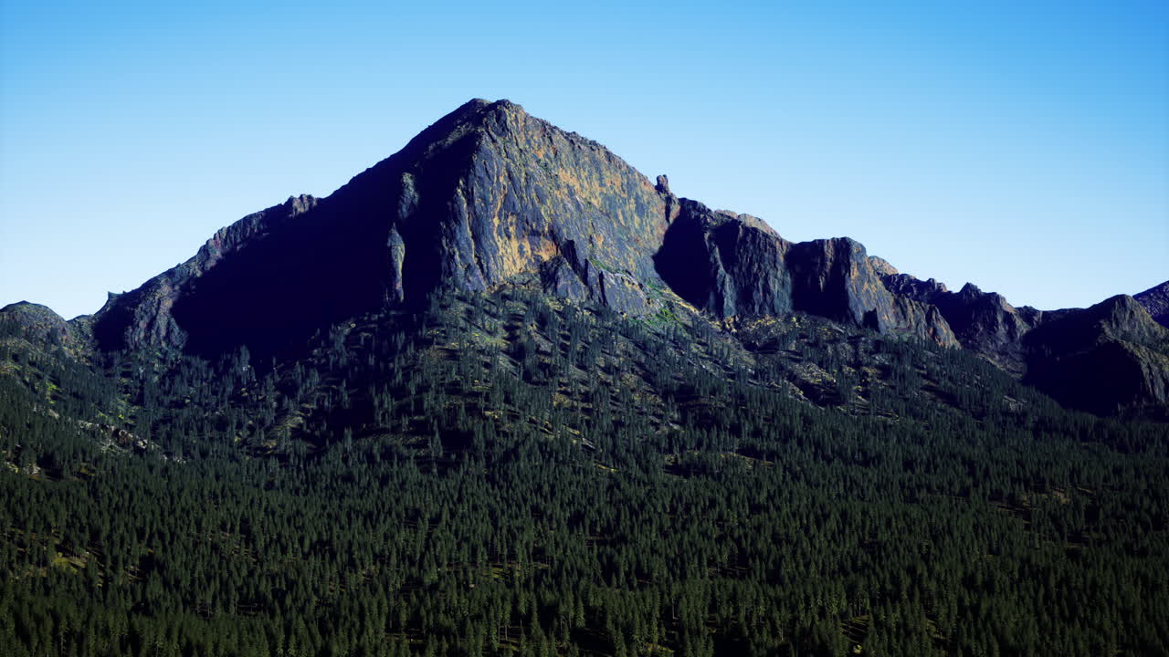 Majestic mountain landscape under clear blue sky in a serene wilderness area