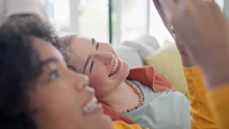 girl friends, movie and phone on sofa