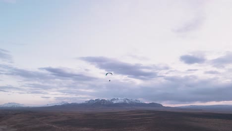 aerial view of paraglider flying in utah, usa