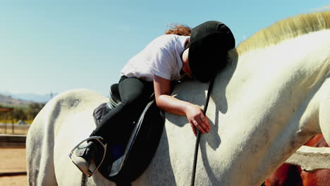 girl embracing the white horse in the ranch 4k