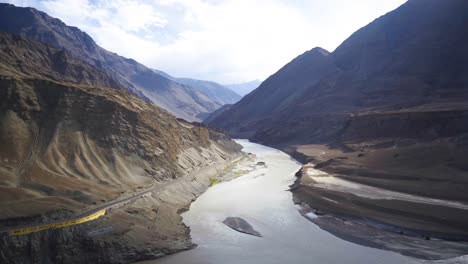 indus and zanskar river confluence or sangam flowing through himalayan mountain valley in ladakh india