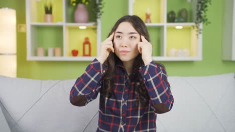 asian young woman with headache. health problems.