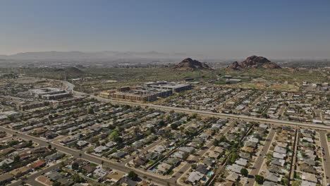 scottsdale arizona aerial v20 cinematic drone flyover residential neighborhood capturing desert landscape with rock formations and phoenix cityscape views - shot with mavic 3 cine - february 2022