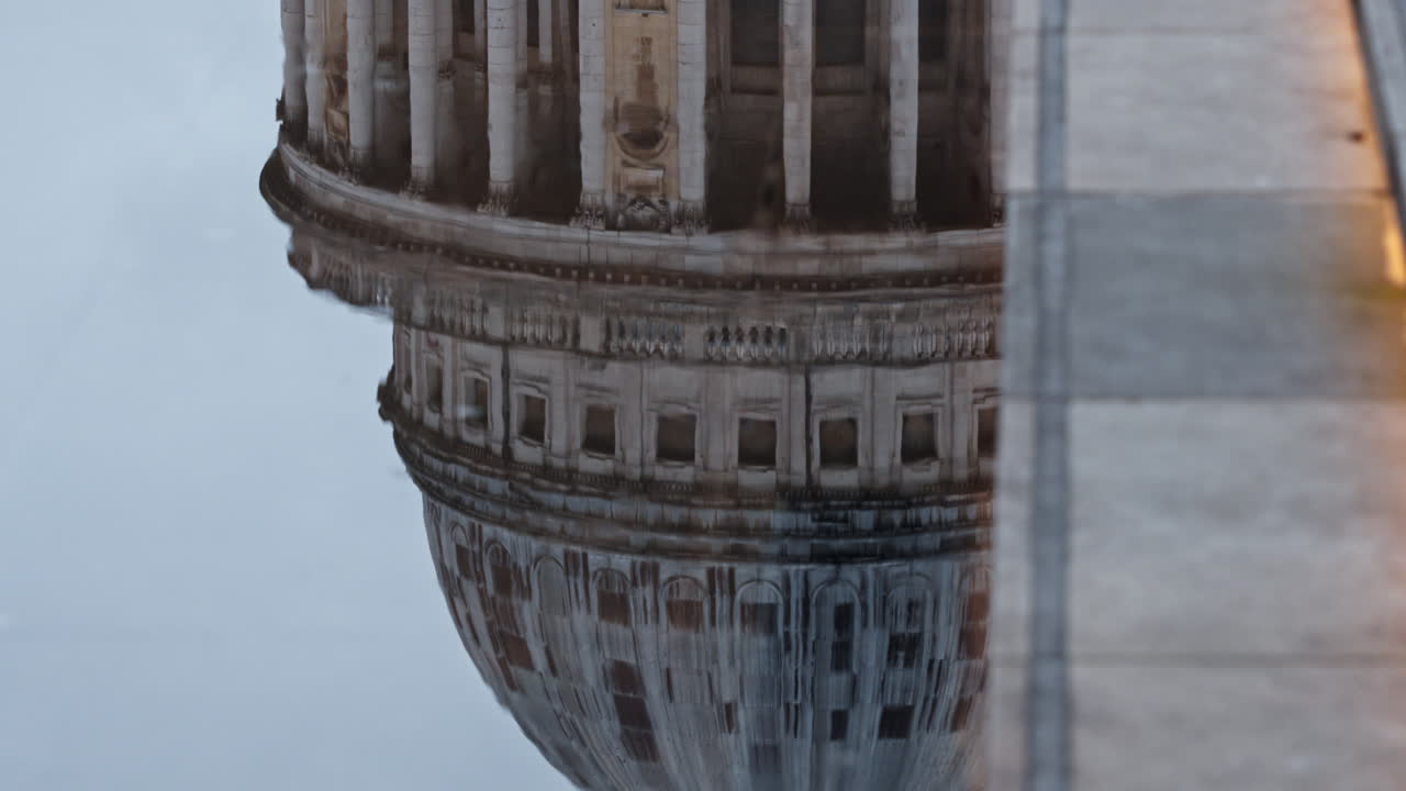 St. Paul's Cathedral reflects serenely in calm water, invoking peace