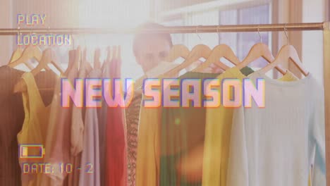 animation of new season text on video camera screen with digital interface and woman shopping