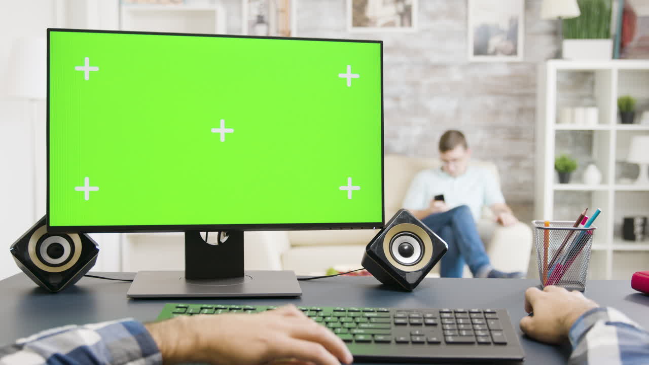 Computer with green screen in home office