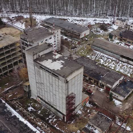 ruined factory in winter time. abolished buildings of industry. empty abandoned place. industrial edifices for demolition. aerial view