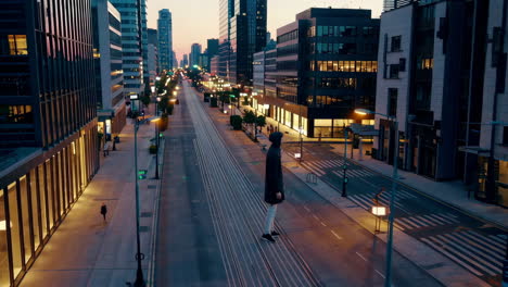 cityscape at night with person wearing a hoodie