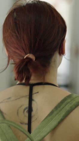 woman with backpack and tattoo