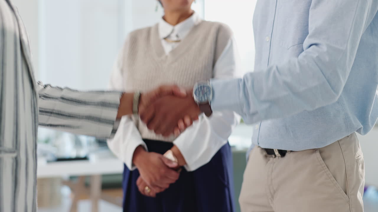 Business handshake in an office setting