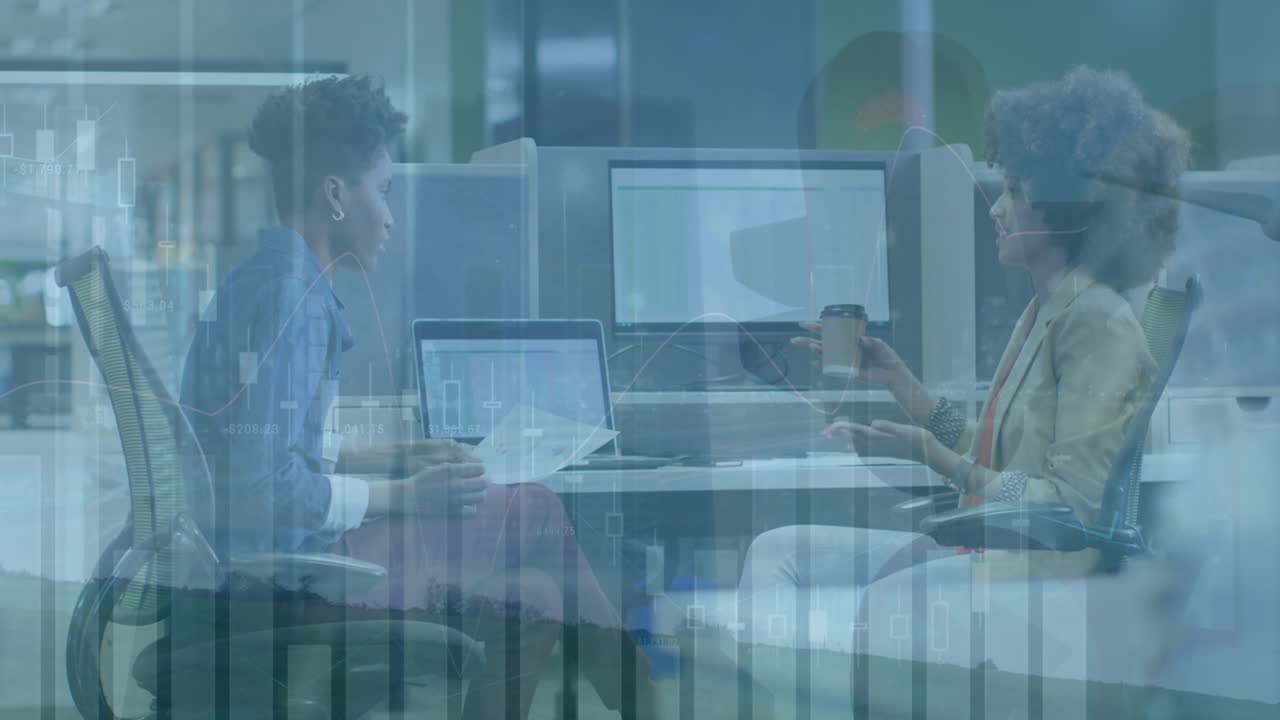 Animation of finance data over caucasian woman working in office