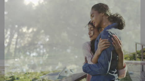 embracing on balcony, two women gazing at scenic landscape animation