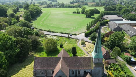 dolly fowrard over the top of a village church in barham in kent, uk