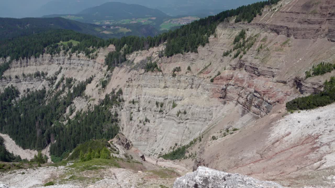 View into the Bletterbach Gorge from above at the foot of the mighty Weisshorn peak near Aldein, South Tyrol, Italy