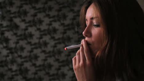 attractive brunette smoking cigarette