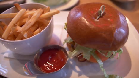 canadian style cheddar burger and fries and ketchup