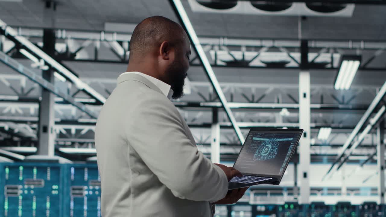 Vertical video Server farm IT specialist using laptop to improve deep learning AI systems