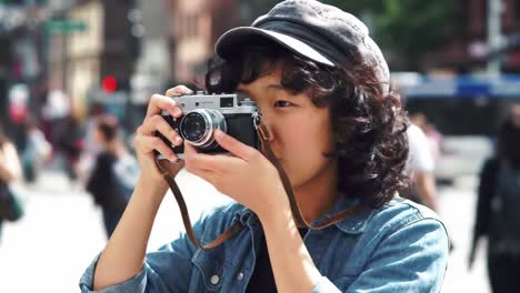 a young photographer capturing moments in a bustling city street with a vintage camera, embracing creativity and urban life's vibrancy