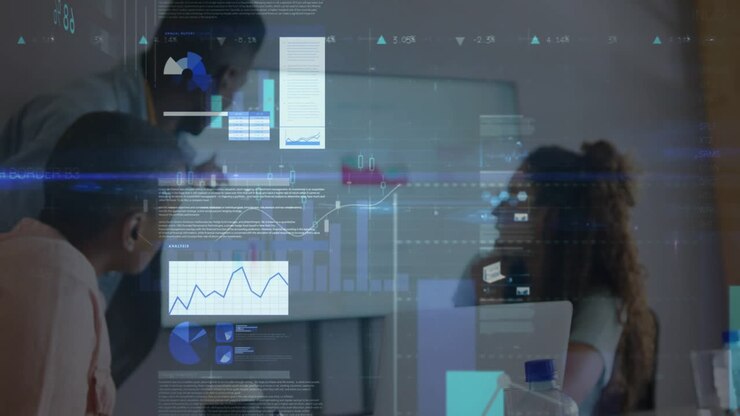 Digital charts fading in on laptop wall monitor, analytics team engaging metrics, aligning insight