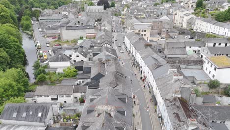 drone flyover of tavistock high street, showcasing the bustling town, buildings, and people, devon, uk