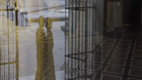 couple reflections in a grand building