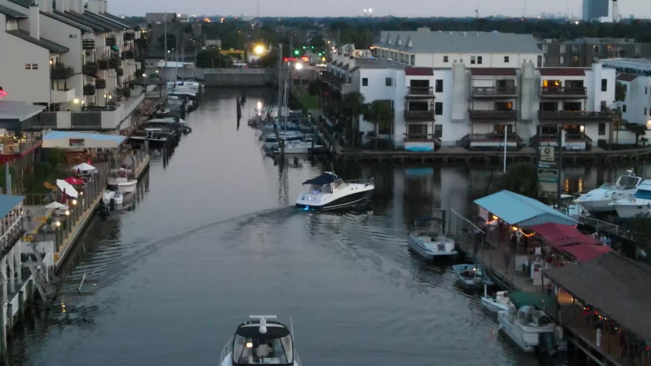 Motorboat Sailing Between The Lakeshore Buildings In New Orleans, Louisiana, USA. aerial