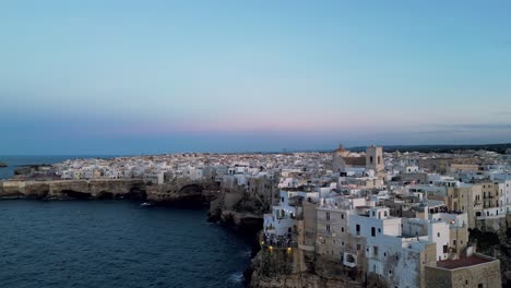 aerial view of polignano a mare, italy at sunset