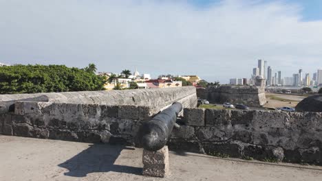 historic cannons on the fortified walls of cartagena, overlooking the cityscape, colombia