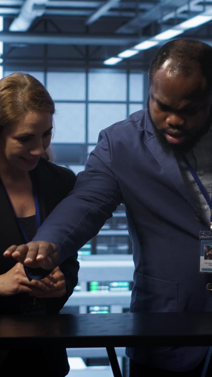 Diverse Business Team Interacting with Virtual Screen in Data Center