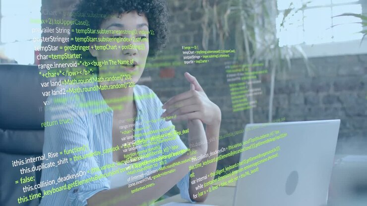 Animation of data processing over biracial businesswoman using laptop in office