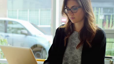 female executive using laptop