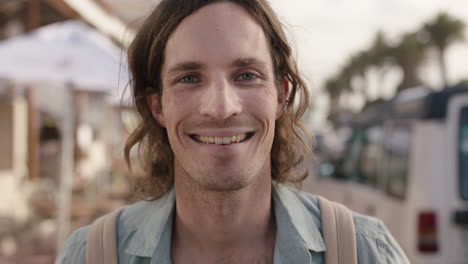 portrait of handsome young man smiling happy enjoying relaxed vacation