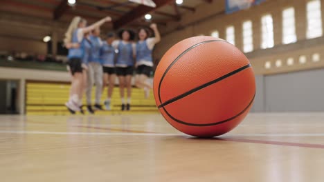 Basketball team celebrating on the court