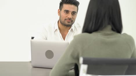 business man interviewing woman, middle east or transcontinental region centered on western asia. concept of recruitment and employment.