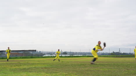 multiracial female baseball players and male umpire, throwing the ball on a pitch, copy space