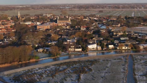 Tracking-drone-flight-behind-flock-of-geese-over-Dutch-countryside